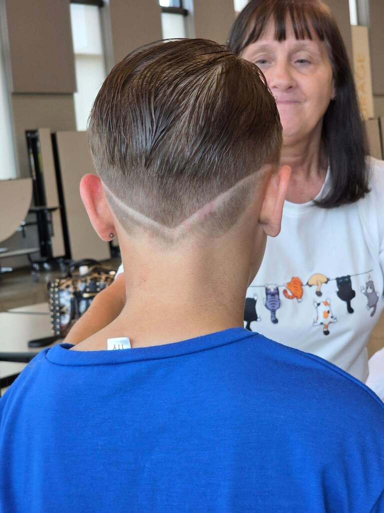 A student's hair after his hair cut