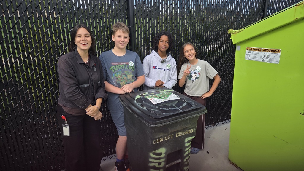 Reporter from TMJ4 and students Colin, Desmond, and Leela with the composting bin