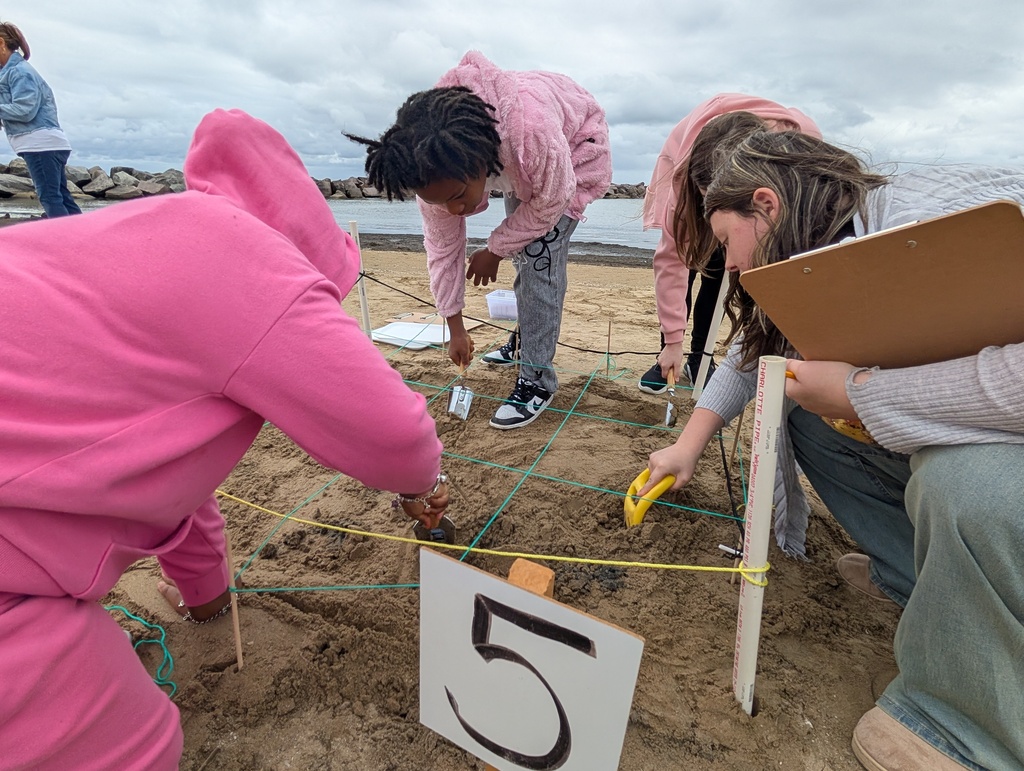 Three Nova Academy students and an instructior on their archaeological dig field trip.