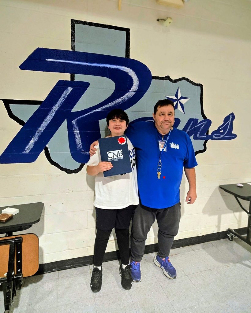 Parent and child pose together after signing up for the students first savings account