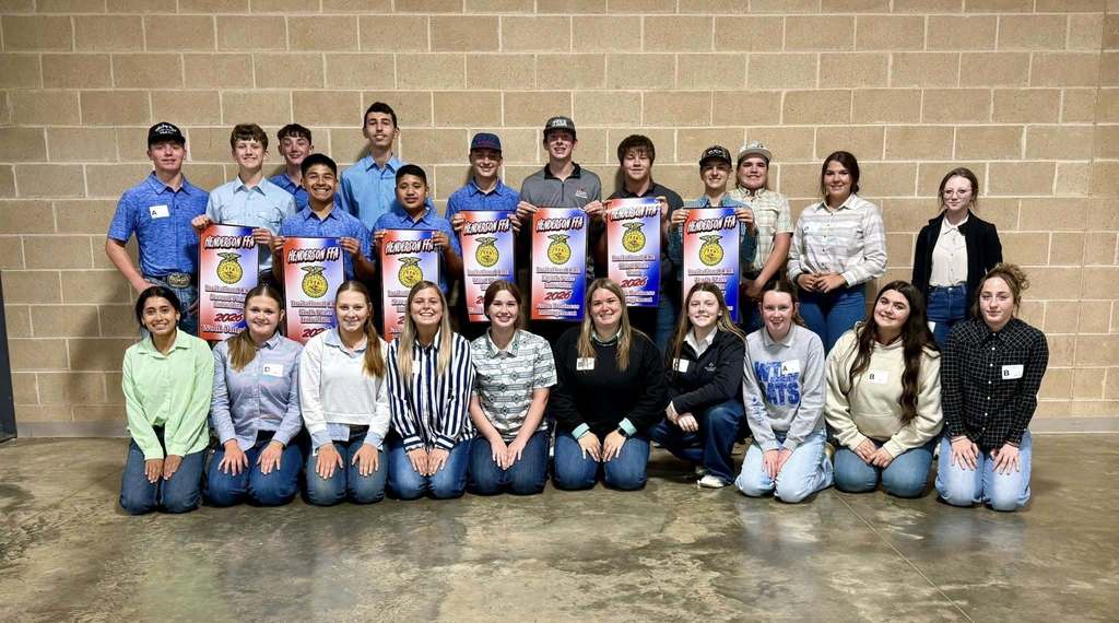 23 FFA members grouped together for a picture with winning banners after a competition in Henderson. 