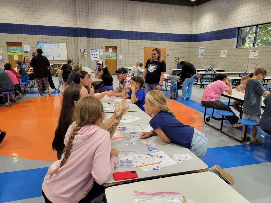 Intermediate Campus Math & Curriculum Night, Teacher helping students do a Math activity