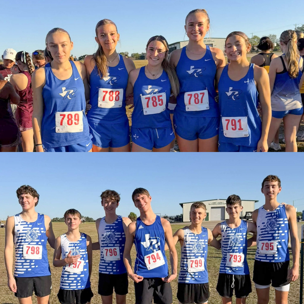 Boy and Girl cross country teams posing for a team picture