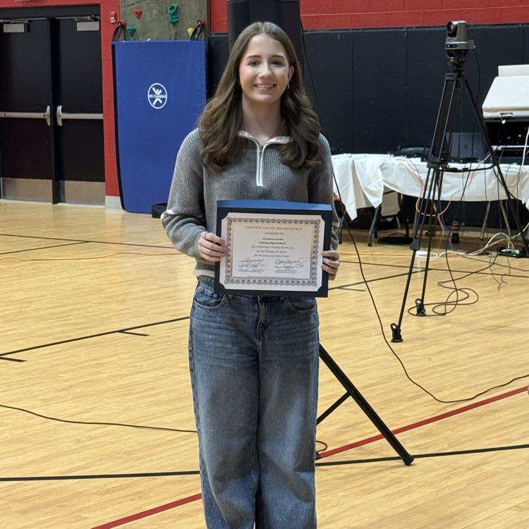 student receiving an award for perfect score on AP test