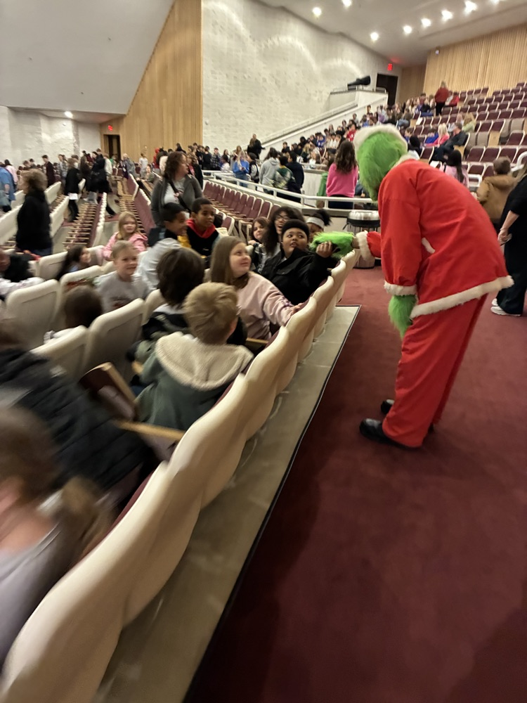 the grinch playing with students 