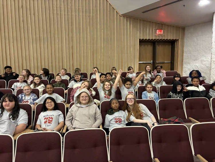 choir students sitting in seats