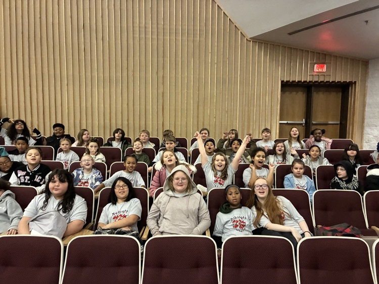 choir students sitting in seats