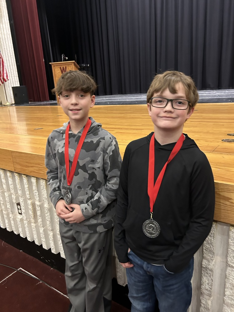 students posing with awards