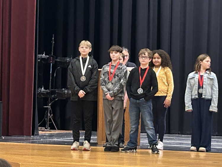 students posing with awards 