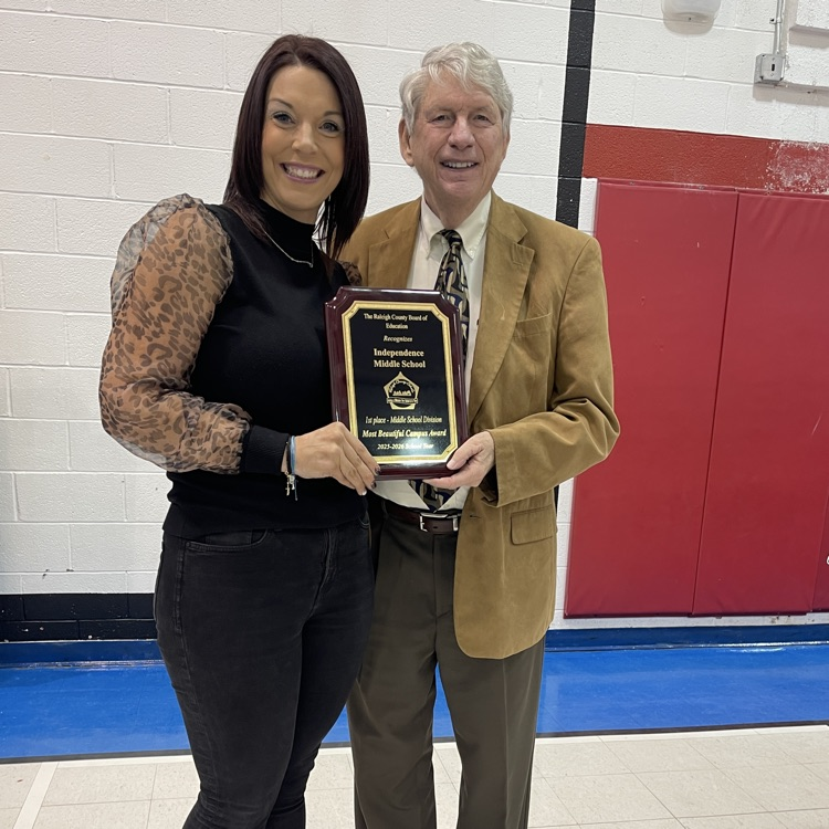 Independence Middle School receiving award for earning 1st Place in the Middle School Division for the Most Beautiful Campus Award.