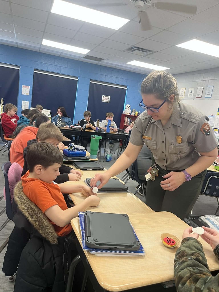 Park Ranger Megan is teaching our Cubs about mining coal. They used different ingredients to make the different layers or ground that surrounds coal.