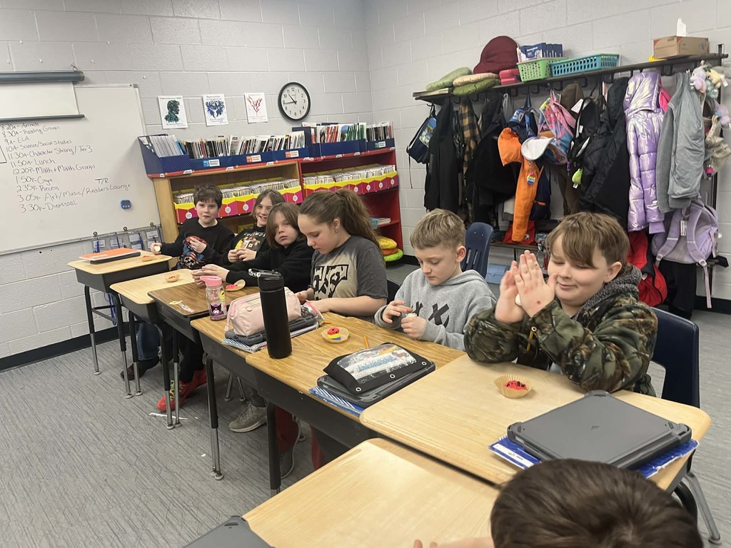 Park Ranger Megan is teaching our Cubs about mining coal. They used different ingredients to make the different layers or ground that surrounds coal.