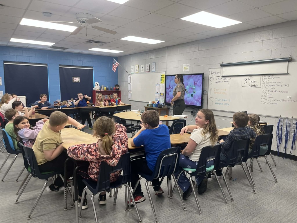 Park Ranger Megan is teaching our Cubs about mining coal. They used different ingredients to make the different layers or ground that surrounds coal.