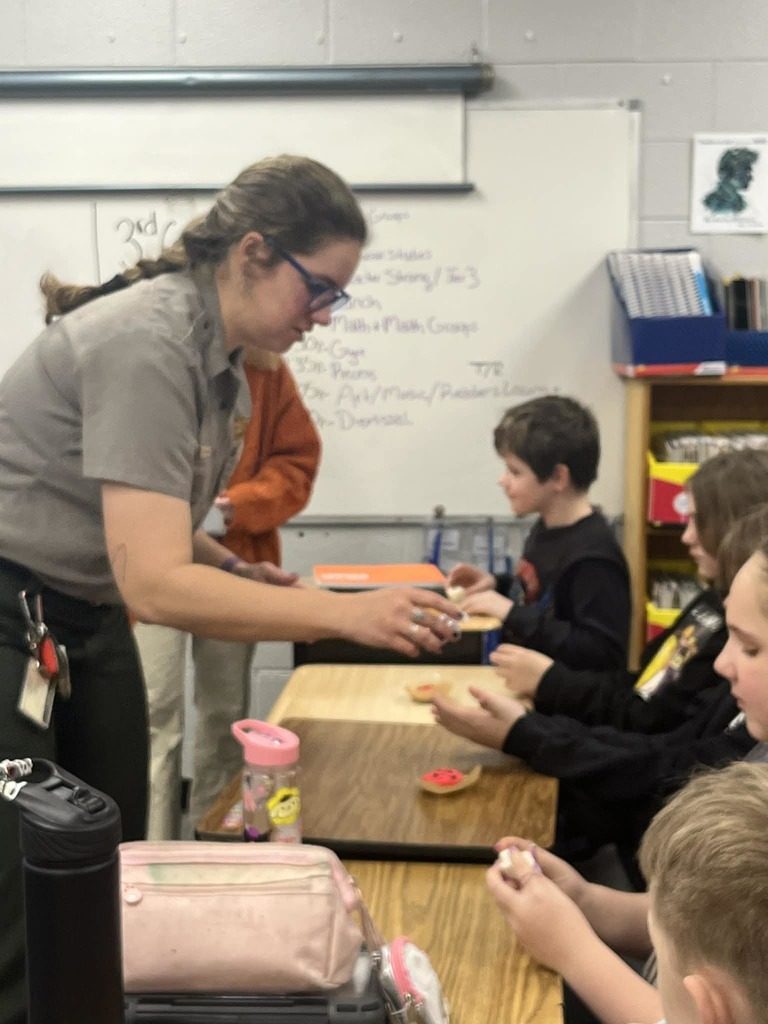 Park Ranger Megan is teaching our Cubs about mining coal. They used different ingredients to make the different layers or ground that surrounds coal.