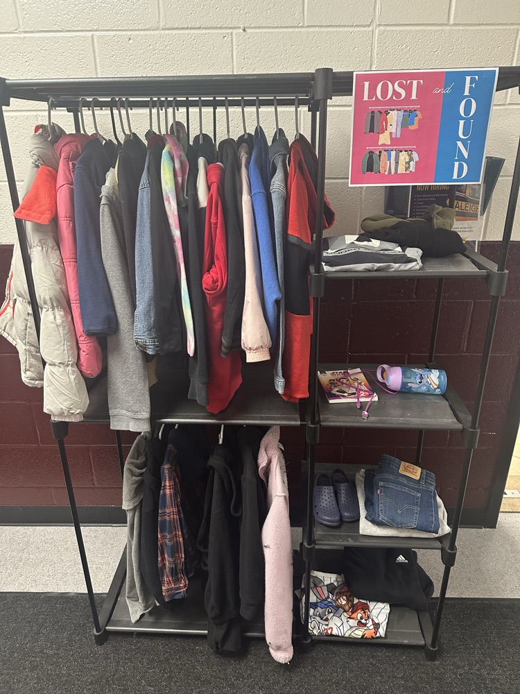 lost and found rack with jackets, sweatshirts, and water bottles