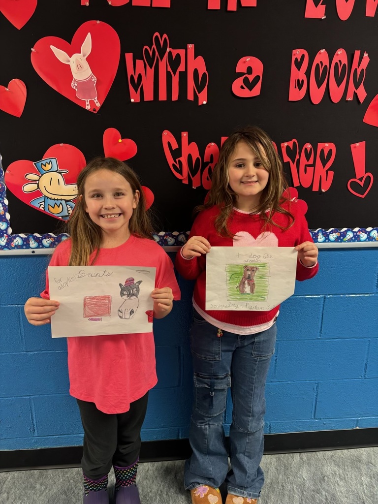 Two girls holding an award