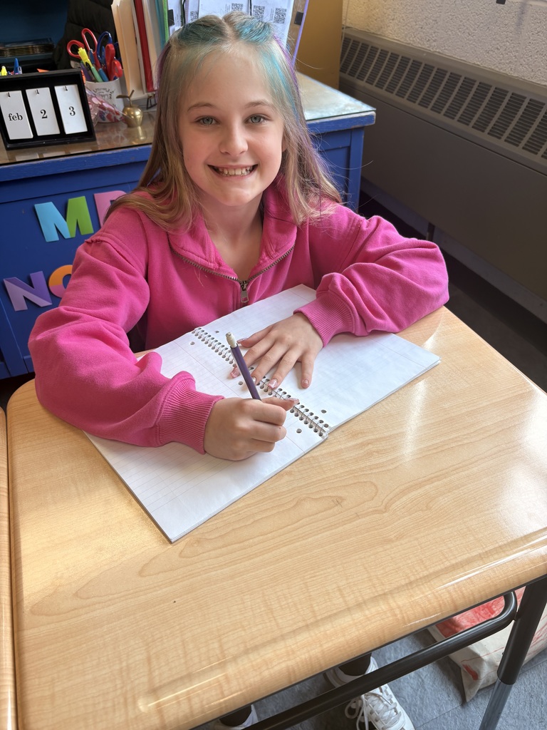 Girl at desk writing