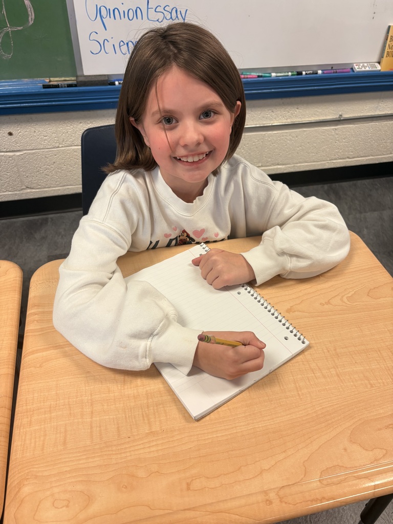 Girl at desk writing