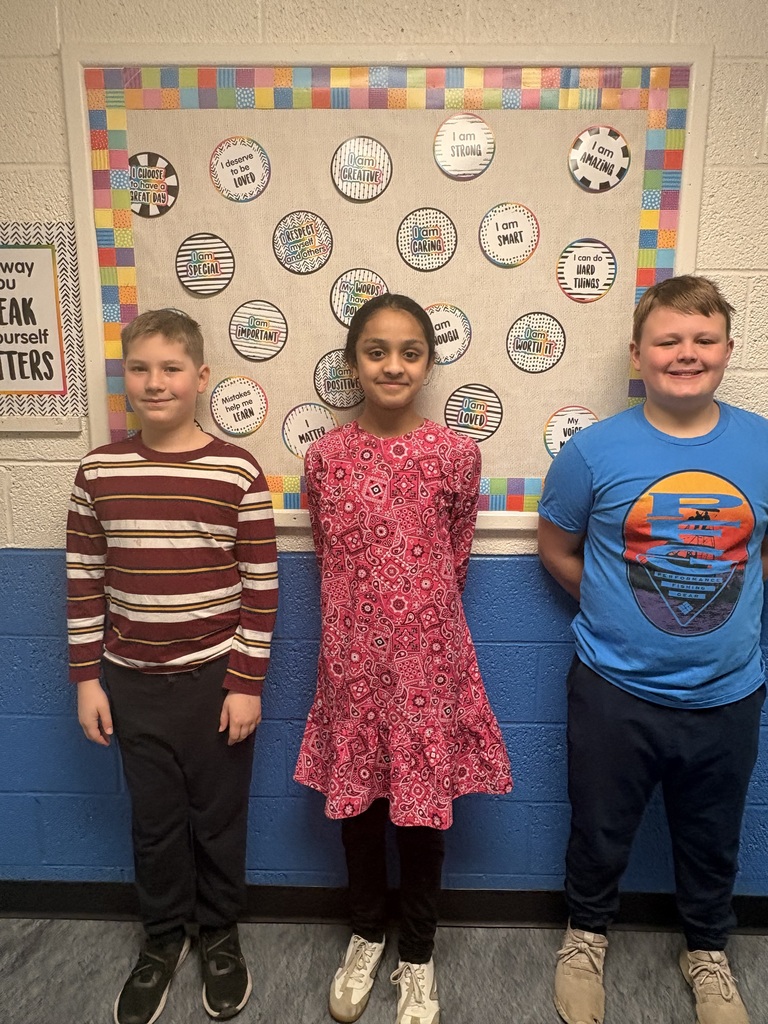 Three students in the hallway