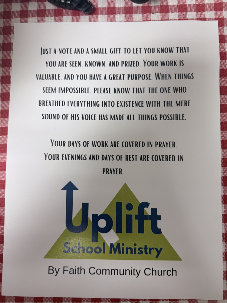 white letter with black writing and green triangle