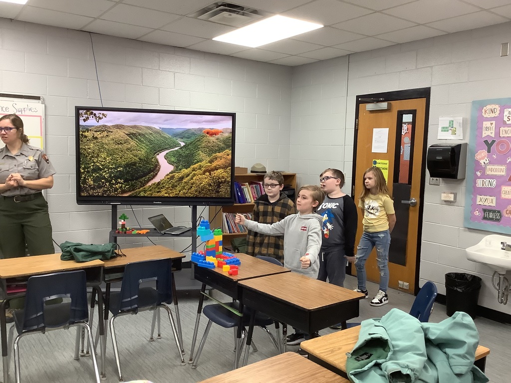 Students are building with blocks at their desks.