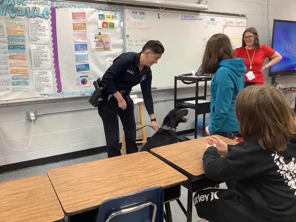 5th grade students get to meet the D.A.R.E. officers police dog. 