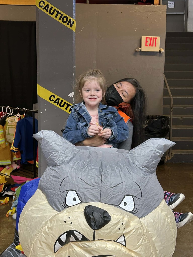 Teacher's Aide in Bulldog Costume at Pre-K Expo with a preschool student