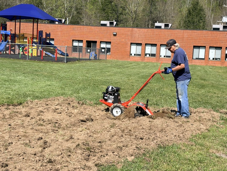 The garden is being tilled.