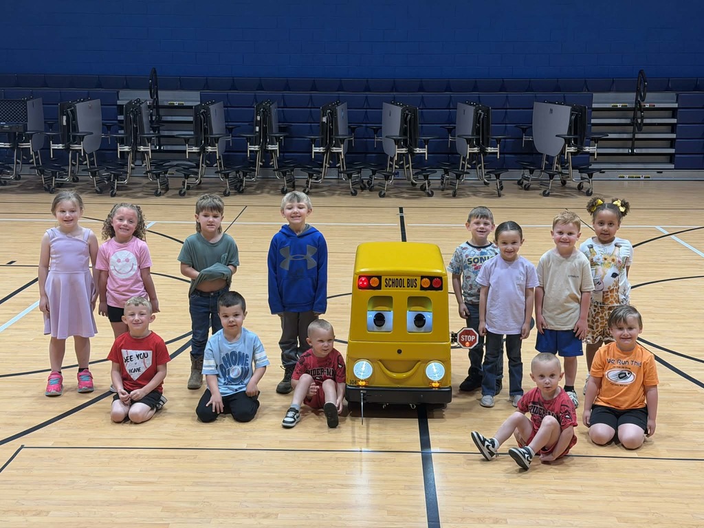 Pre-K Students with Barney the Bus. 