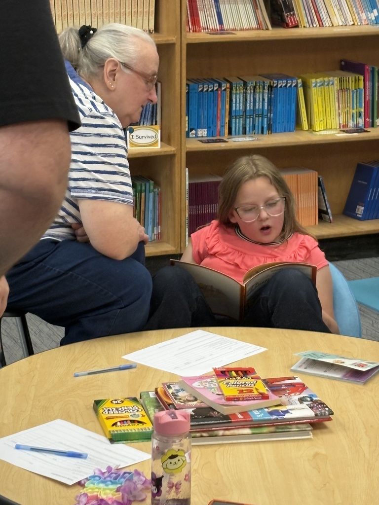 Cubs reading to family members. 