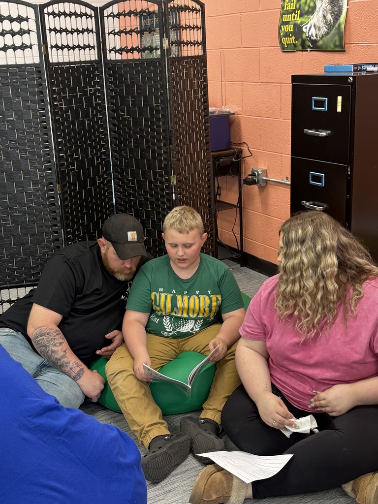 Cubs reading to family members. 