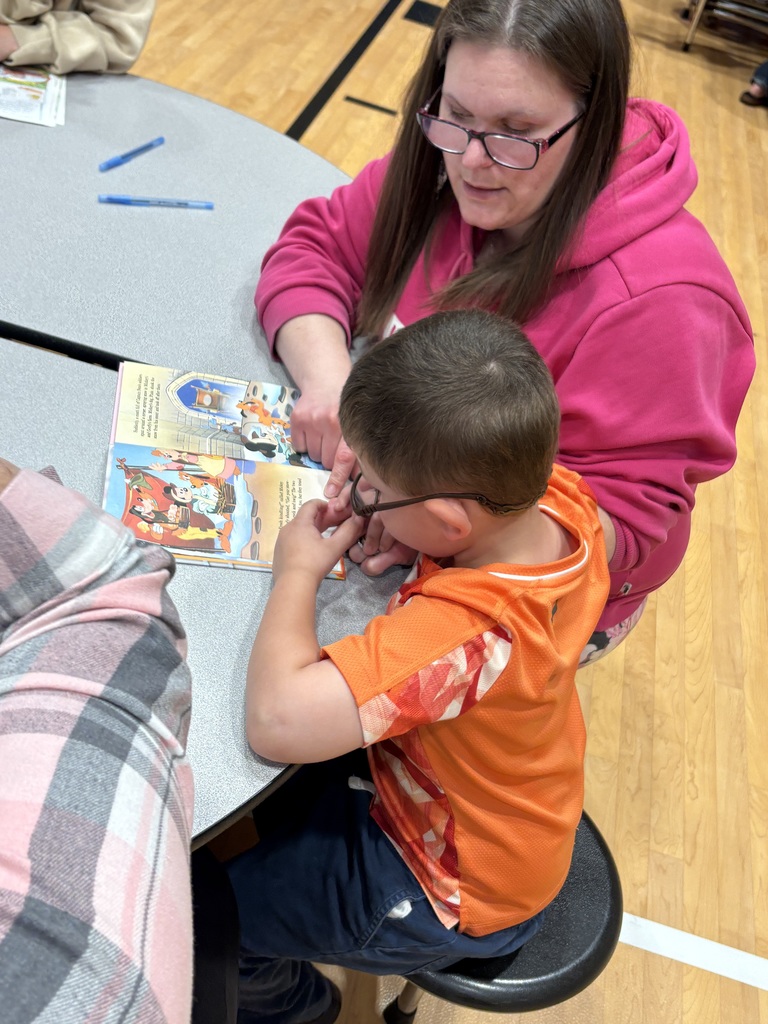 Cubs reading to family members. 