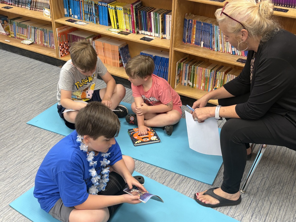 Cubs reading to family members. 