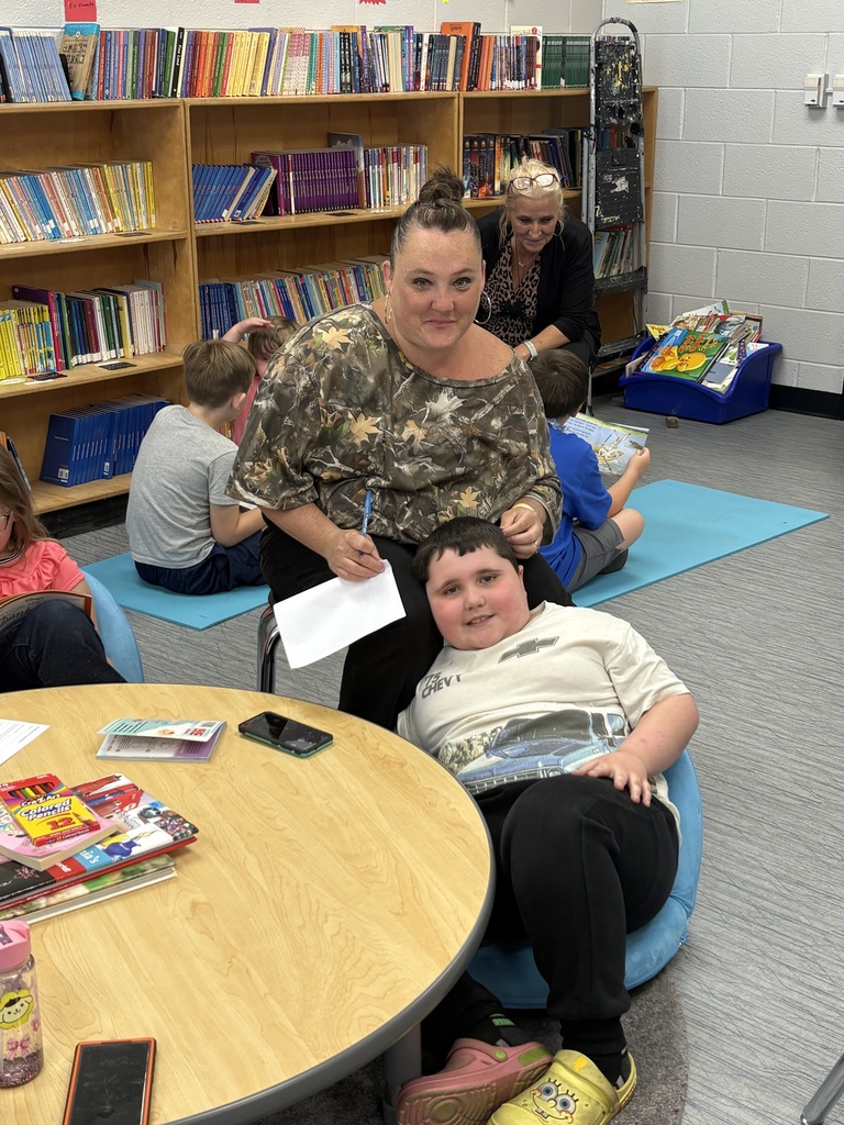 Cubs reading to family members. 