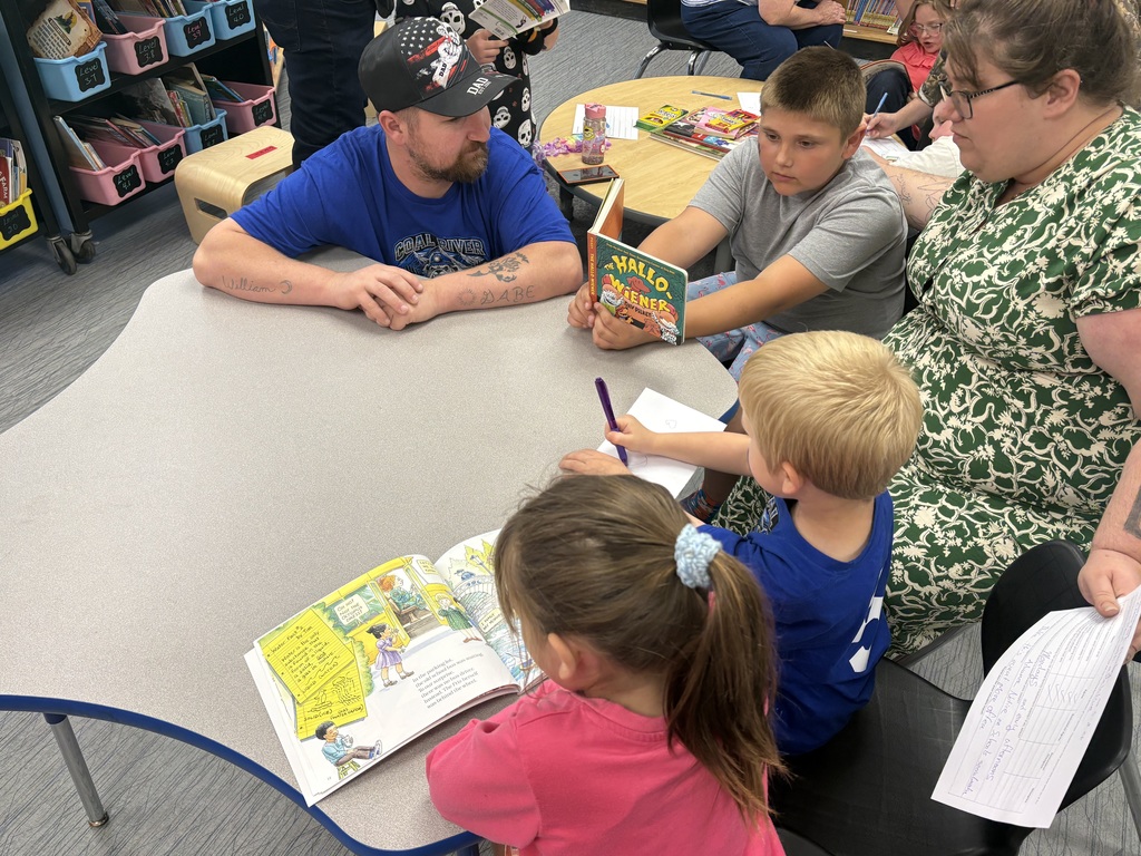 Cubs reading to family members. 