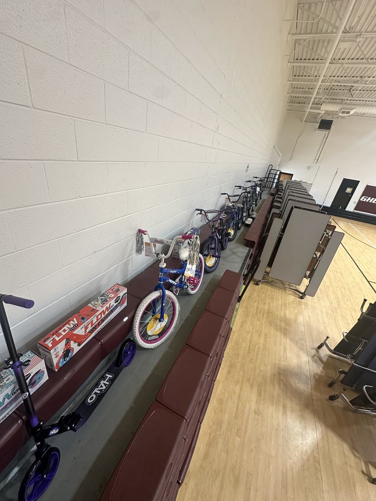 Bikes, scooters, and skateboards on top of the bleachers