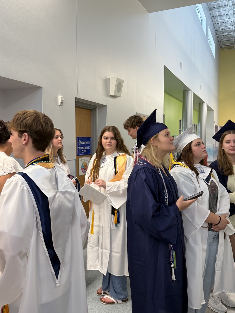 Graduates trying to locate their tile in the Ridgeview Mural
