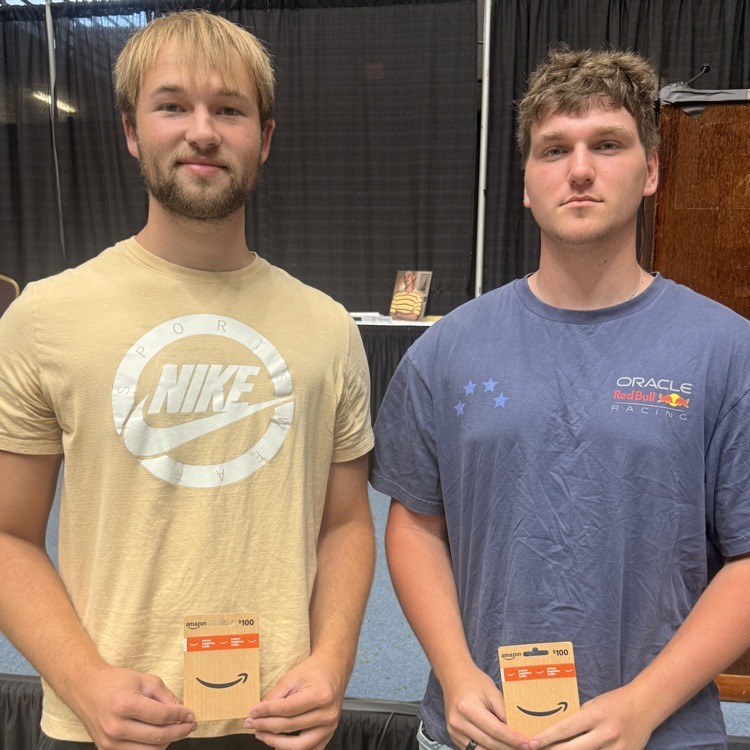 Bryce and Connor posing with Amazon gift cards 