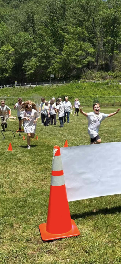 Cubs Crossing the Finish Line of the Run. 