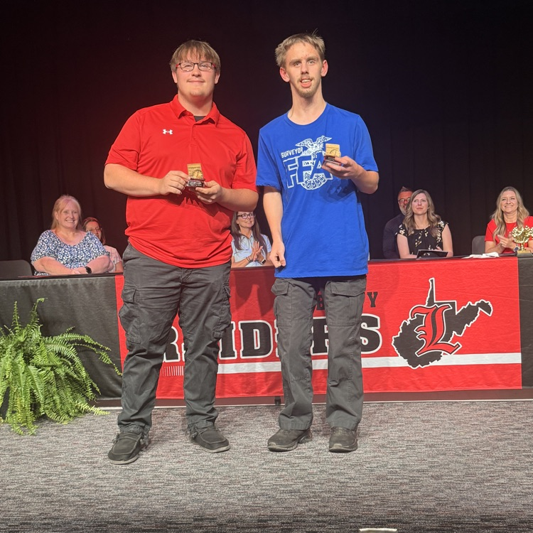 Logan and Dustin receiving perfect attendance award
