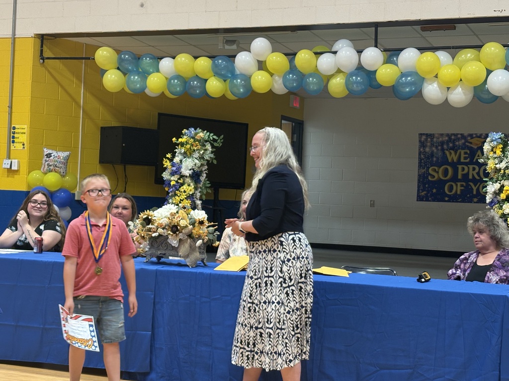 Cubs receiving their awards. 