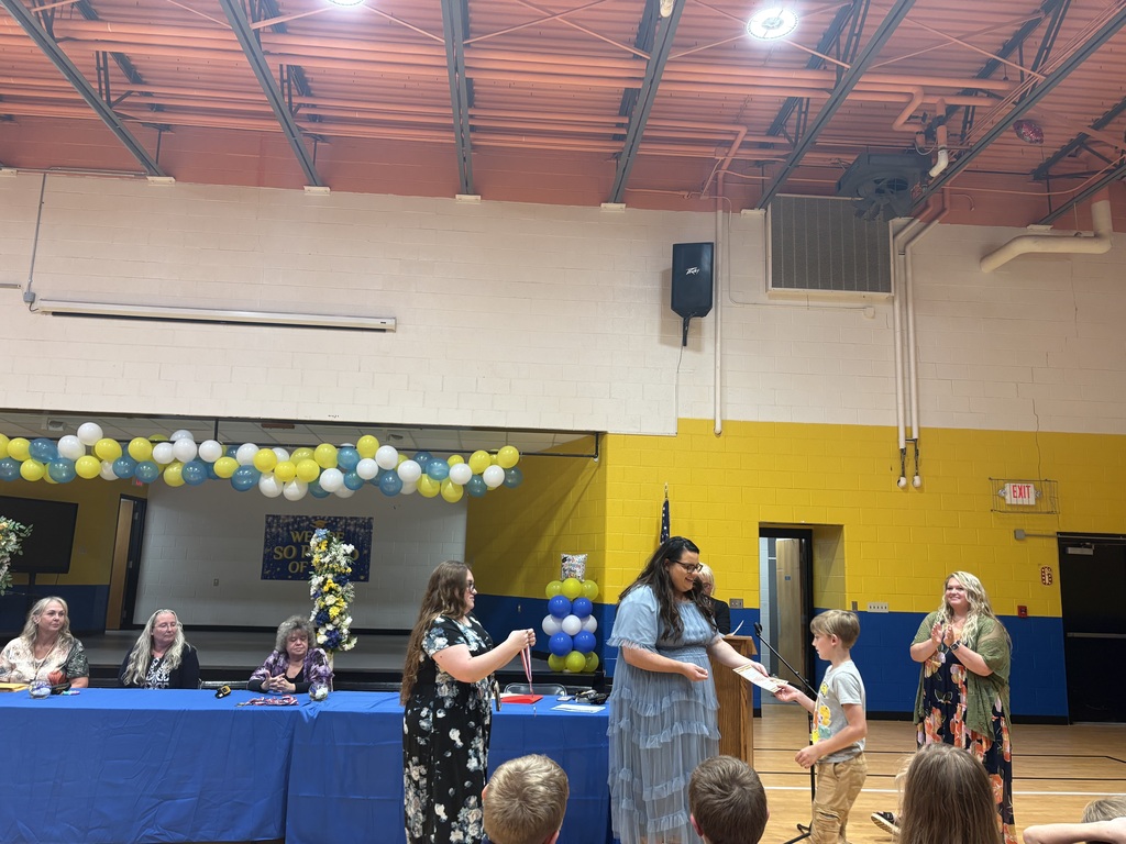 Cubs receiving their awards. 