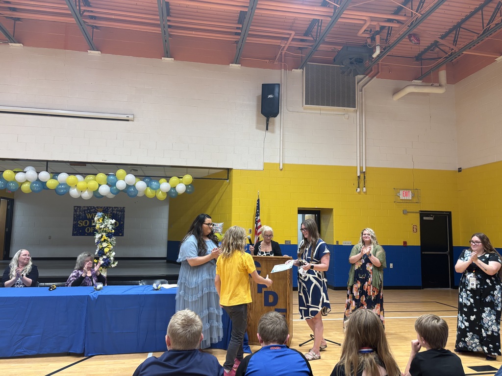 Cubs receiving their awards. 