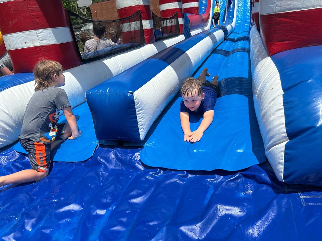 Cubs going down the waterslides. 
