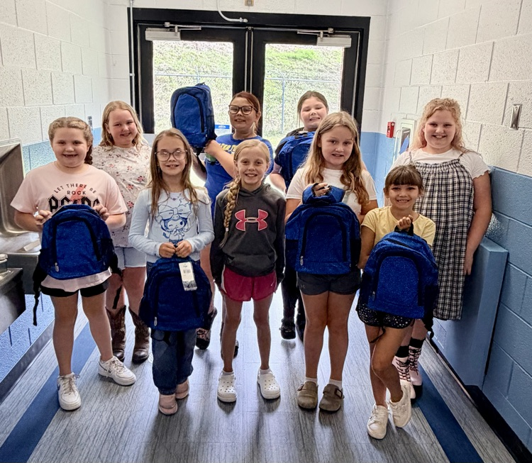 cheerleaders with new bags donated 