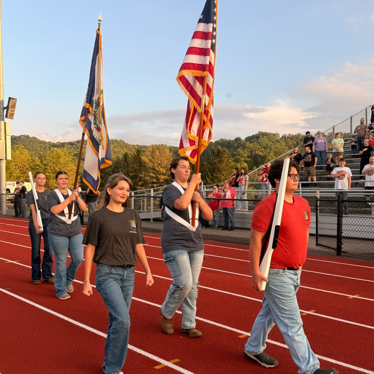 students walking with flags