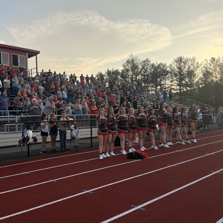 cheerleaders pledging allegiance on track