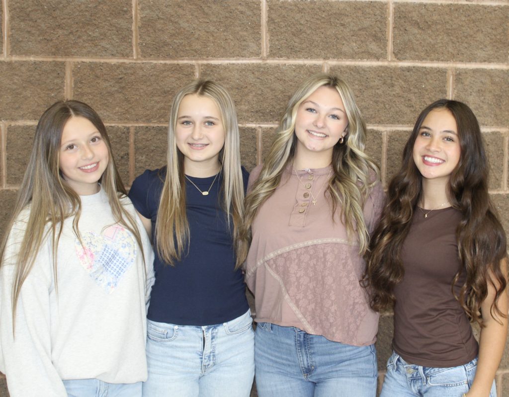 2026-2027 Trap Hill Homecoming  Attendants  Eight Grade Attendants are Kerigan Trump, Kallie Acord, Payton Walker, and Ava Yee.   Students standing in front of a brick wall. 