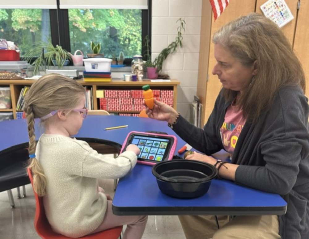 Students working with AAC
