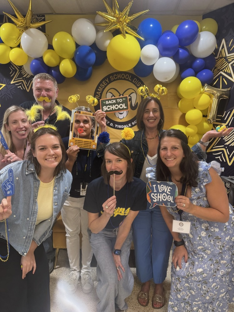 teachers posing with props